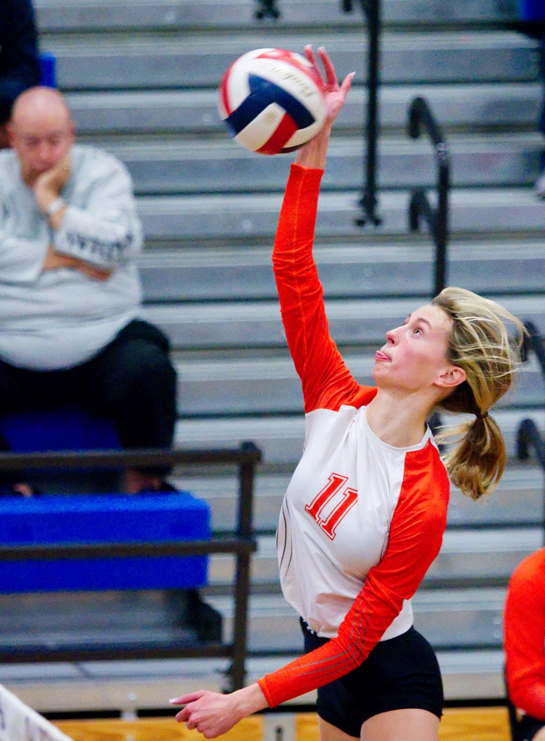 Olivia Hughes sends the ball back over the net with some gusto. [view more volleyball shots]